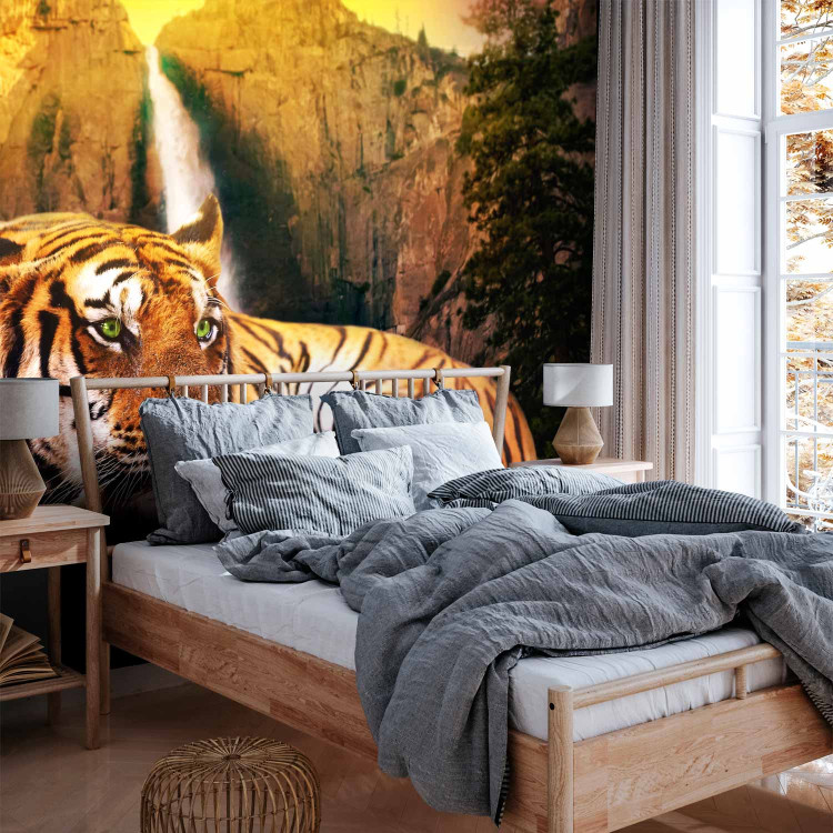Wall Mural Peace of Nature - Beautiful tiger lying on rocks by a waterfall 61348 additionalImage 2
