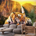 Wall Mural Peace of Nature - Beautiful tiger lying on rocks by a waterfall 61348