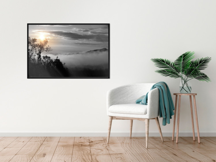 Poster Sunrise - dark landscape of trees against clouds and dense fog 117258 additionalImage 5
