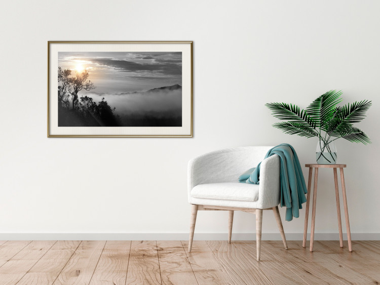 Poster Sunrise - dark landscape of trees against clouds and dense fog 117258 additionalImage 21