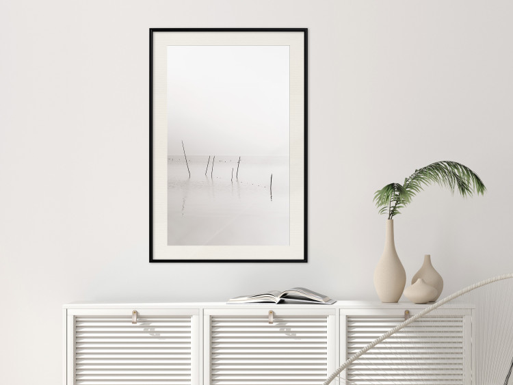 Poster Misty Trail - landscape of sticks protruding from the water on a white background 130378 additionalImage 25
