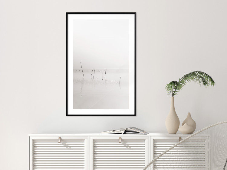 Poster Misty Trail - landscape of sticks protruding from the water on a white background 130378 additionalImage 23
