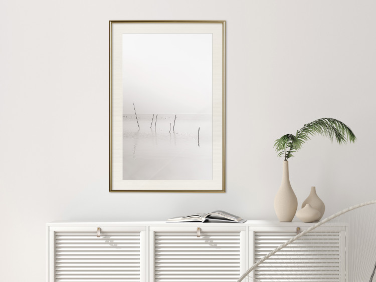 Poster Misty Trail - landscape of sticks protruding from the water on a white background 130378 additionalImage 24