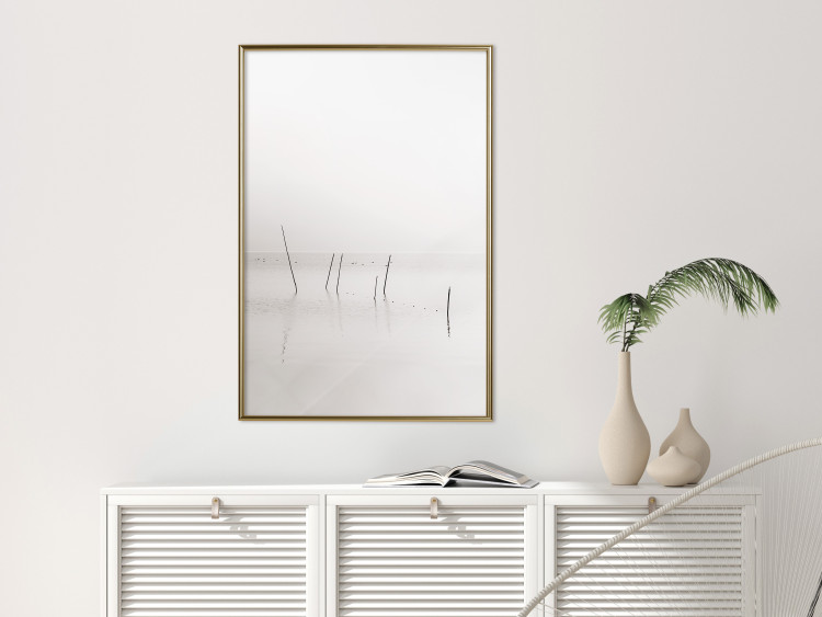Poster Misty Trail - landscape of sticks protruding from the water on a white background 130378 additionalImage 5