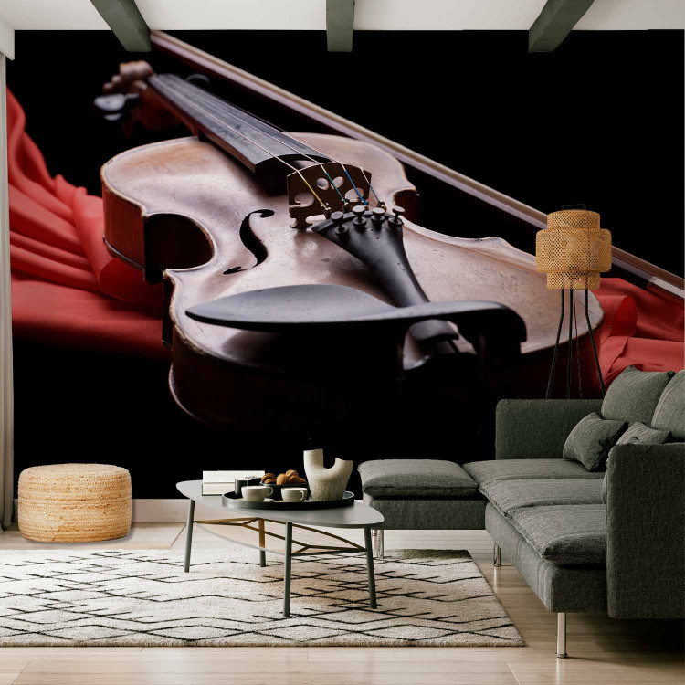 Wall Mural Classical Music - Violin lying on a red scarf on a black background 61378