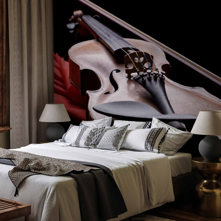 Wall Mural Classical Music - Violin lying on a red scarf on a black background 61378 additionalImage 2