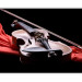 Wall Mural Classical Music - Violin lying on a red scarf on a black background 61378 additionalThumb 5