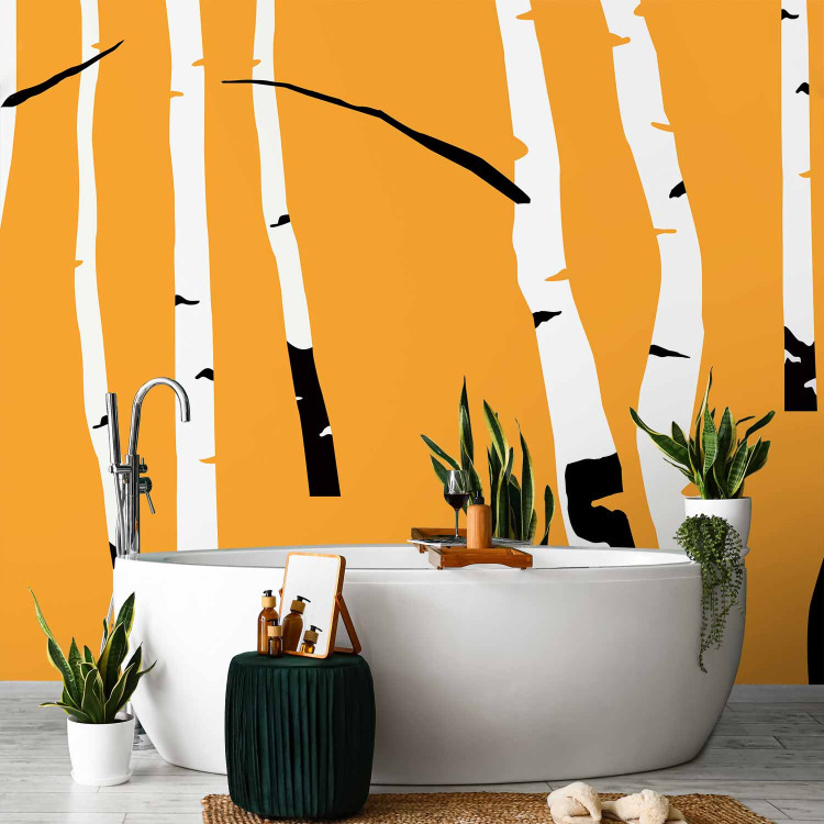 Wall Mural Birch forest - black and white tree trunks on an orange coloured background 96609 additionalImage 8
