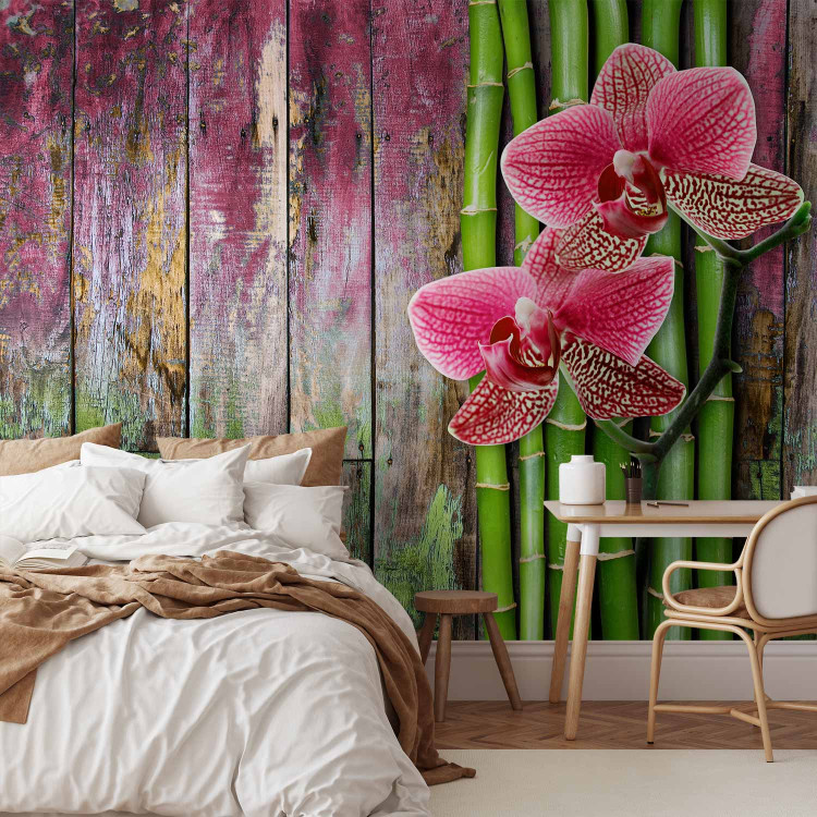 Photo Wallpaper Centered Orchids - Floral Motif on a Wooden Background with Bamboo 60239