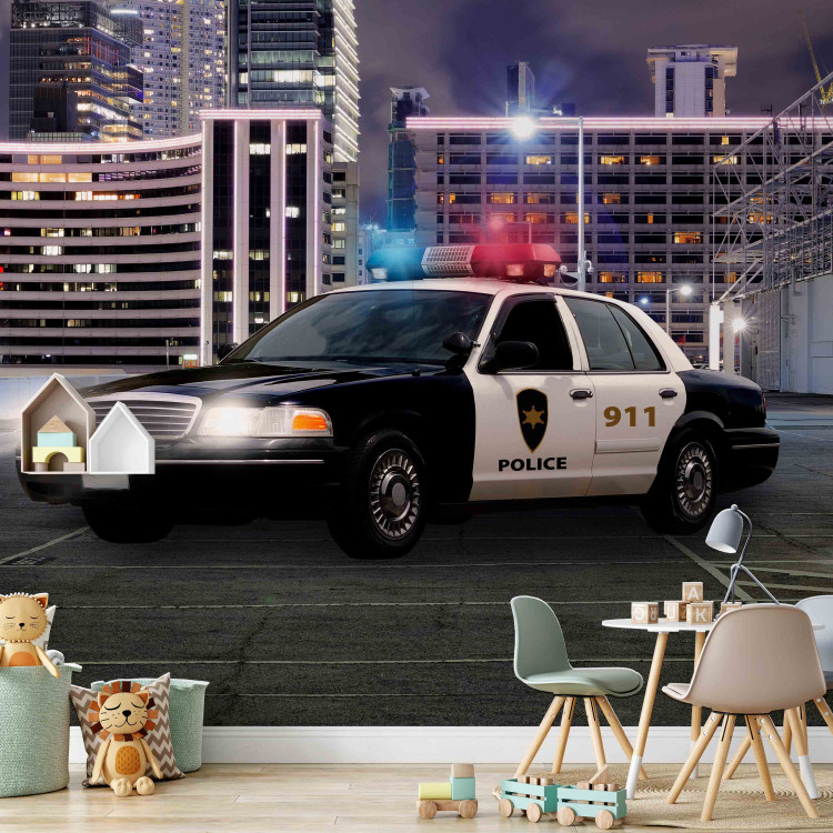 Wall Mural Police car at night - police car motif on a background of city architecture 97049 additionalImage 6