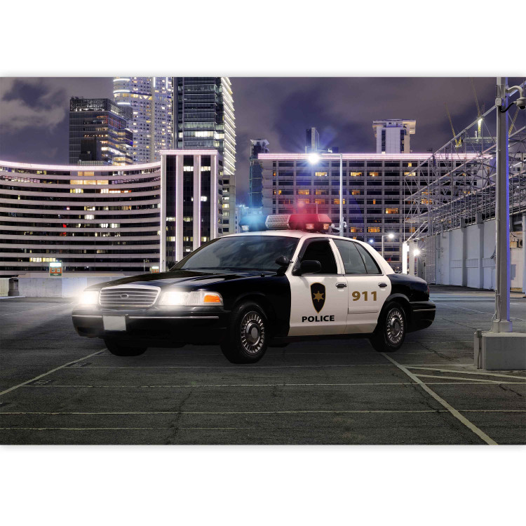 Wall Mural Police car at night - police car motif on a background of city architecture 97049 additionalImage 3