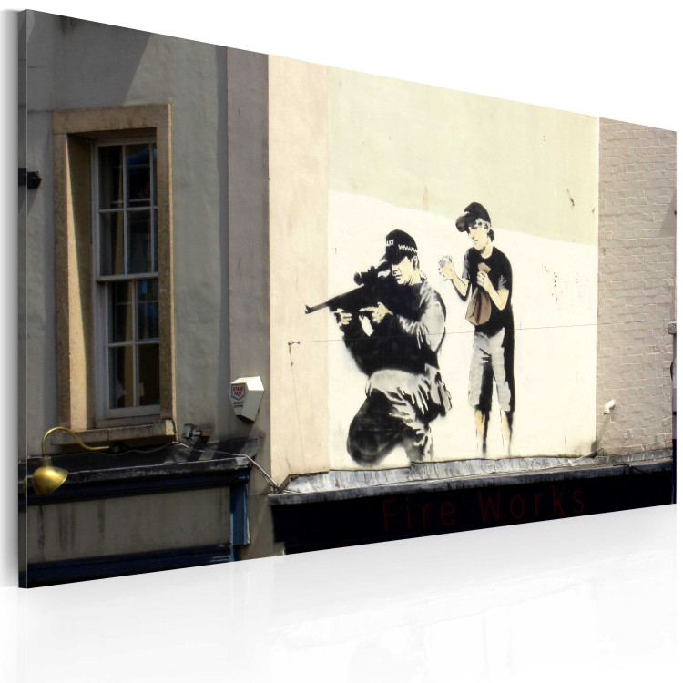 Canvas Print Behind the enemy's back - graffiti a'la Banksy with a boy and a sniper 58959 additionalImage 2