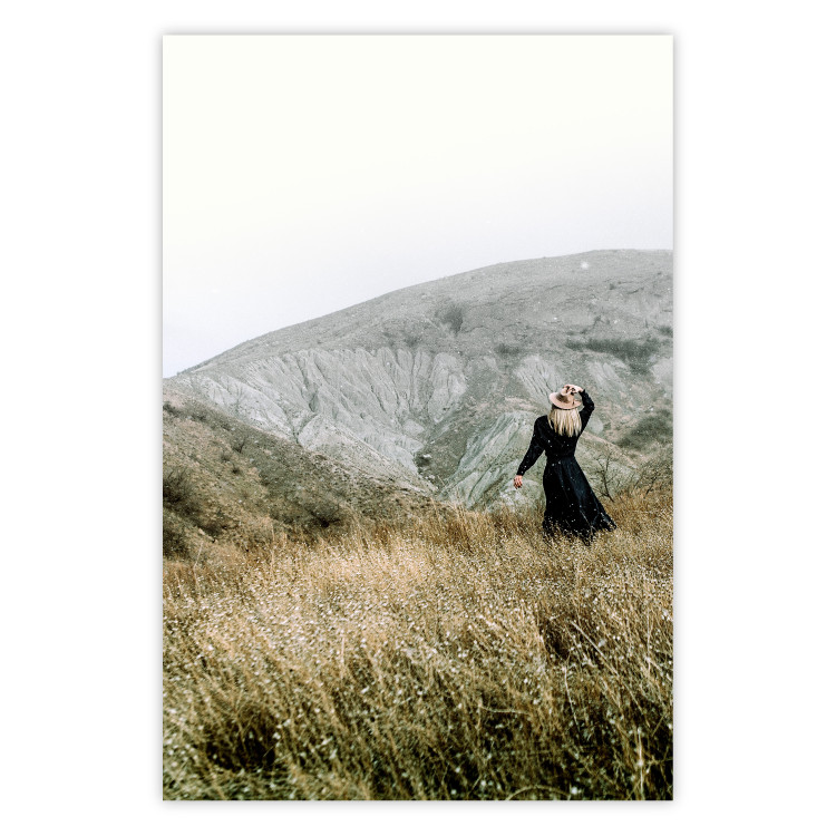 Poster Lost in Nature - landscape of a meadow with a woman against a mountain range 130279