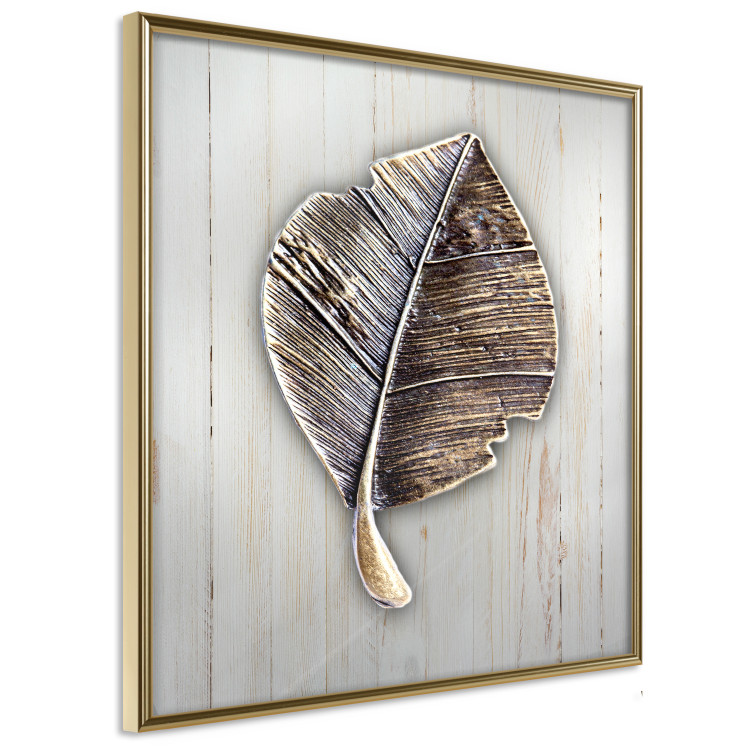 Poster Enchanted in Gold - autumn abstraction with a leaf on a light wood background 118789 additionalImage 14