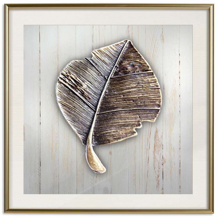 Poster Enchanted in Gold - autumn abstraction with a leaf on a light wood background 118789 additionalImage 19
