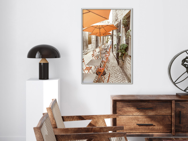 Poster Summer Morning - restaurant tables and street in an Italian town 135889 additionalImage 16