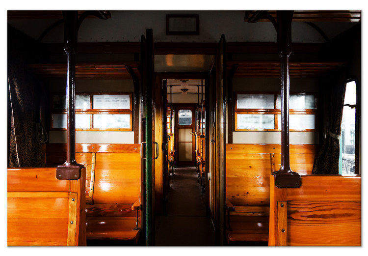 Canvas Passenger train - a photo from inside of a wagon with wooden benches 123799