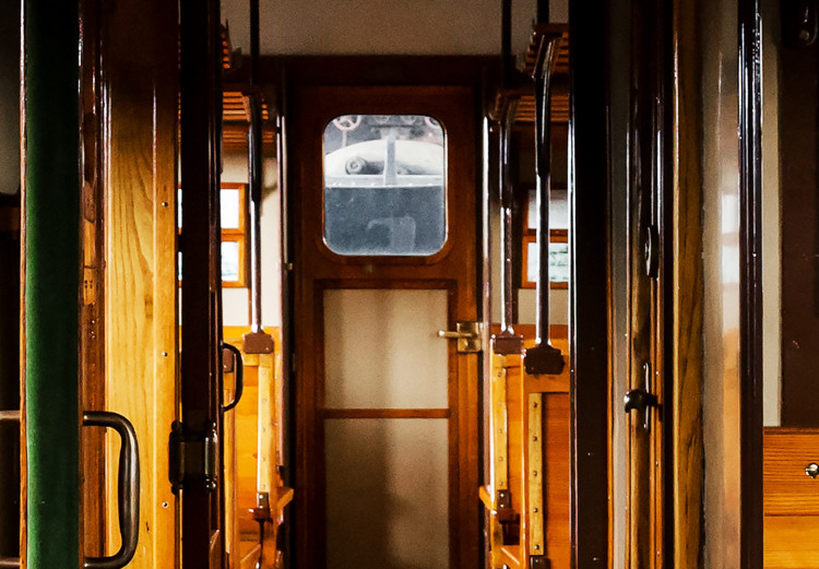 Canvas Passenger train - a photo from inside of a wagon with wooden benches 123799 additionalImage 5