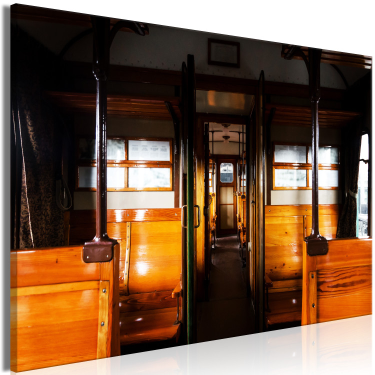 Canvas Passenger train - a photo from inside of a wagon with wooden benches 123799 additionalImage 2