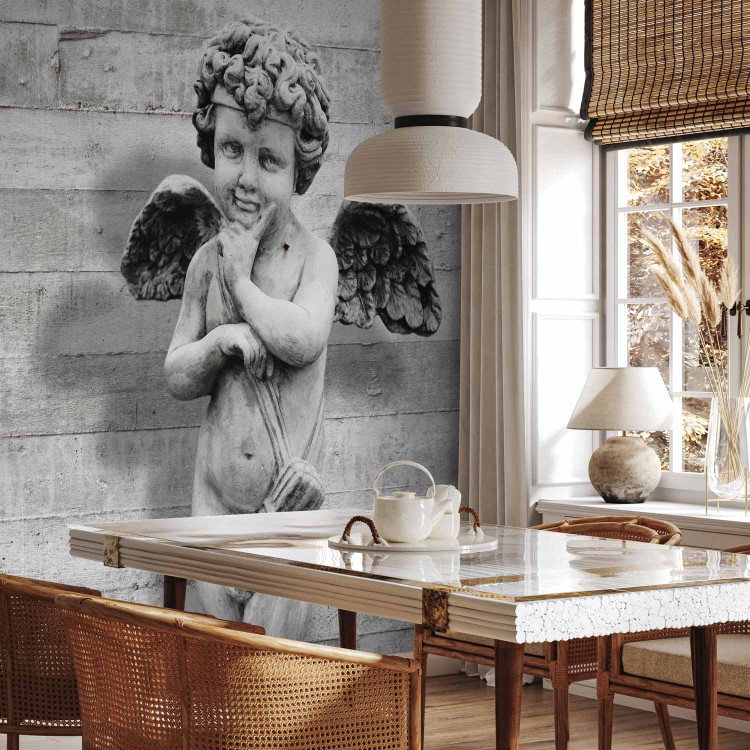 Wall Mural Charming stone cherub - angel sculpture against a background of concrete stripes 64499 additionalImage 4