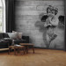 Wall Mural Charming stone cherub - angel sculpture against a background of concrete stripes 64499